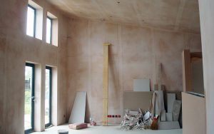 plastered room with high windows